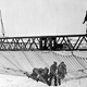 Workers install the first section of a huge safety net, at a cost of $98,000, that will extend from shore to shore beneath the Golden Gate Bridge span during construction of the bridge in San Francisco, Ca., Sept. 2, 1935.